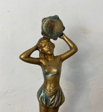 Load image into Gallery viewer, This stunning Art Deco piece features a glamorous lady flapper in superb, intricate detail. She is wearing skimpy clothing and holding up her decorative tambourines at the top, posing standing on a rocky floor to create a stand-out antique design.
