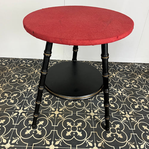 Stylish early 20th-century ebonised faux bamboo coffee or side table with a fantastic design featuring the trend ebony tone with a turned leg finish and sleek gold highlights. It is created in a cricket form with three legs