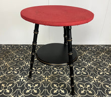 Load image into Gallery viewer, Stylish early 20th-century ebonised faux bamboo coffee or side table with a fantastic design featuring the trend ebony tone with a turned leg finish and sleek gold highlights. It is created in a cricket form with three legs
