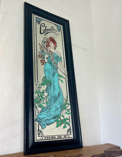 Excellent Mucha collectables piece features an elegant lady in a stylish dress in a turquoise blue finish flowing down with a vivid robe to create a great design.