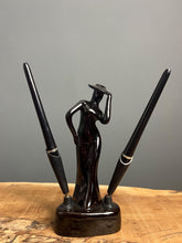 Load image into Gallery viewer, This fabulous piece showcases a glamorous lady, artfully sculpted and adorned with a vibrant black glaze pottery finish
