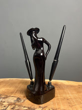 Load image into Gallery viewer, This fabulous piece showcases a glamorous lady, artfully sculpted and adorned with a vibrant black glaze pottery finish
