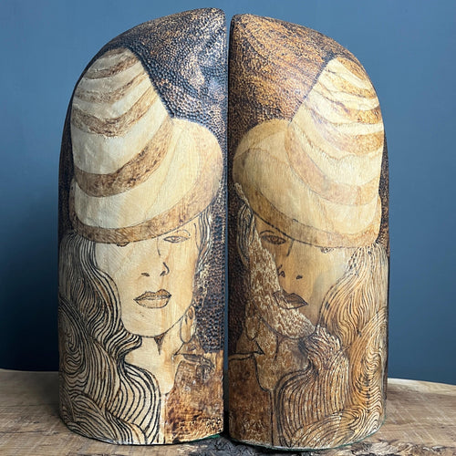 Stunning vintage designer art deco bookends featuring a glamorous lady, intricately detailed in pokerwork, adorned in stylish clothing. The wooden design showcases excellent craftsmanship, making these bookends ideal for holding large books.