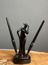 Load image into Gallery viewer, This fabulous piece showcases a glamorous lady, artfully sculpted and adorned with a vibrant black glaze pottery finish
