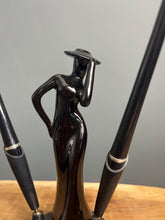 Load image into Gallery viewer, This fabulous piece showcases a glamorous lady, artfully sculpted and adorned with a vibrant black glaze pottery finish
