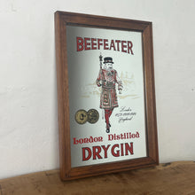 Load image into Gallery viewer, vintage Gordon’s London dry gin mirror, an advertising collectable for wines and spirits. The stunning design features the famous London gin brand in vivid red fonts, a vibrant gold background, and a picture of the familiar logo
