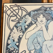 Load image into Gallery viewer, This vintage art nouveau wooden wall plaque, with a blue effect, is a unique piece of art. It features an elegant lady wearing an attractive headdress, her hair tied up, and a selection of glamorous clothing.
