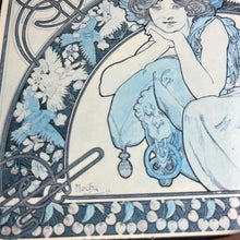 Load image into Gallery viewer, This vintage art nouveau wooden wall plaque, with a blue effect, is a unique piece of art. It features an elegant lady wearing an attractive headdress, her hair tied up, and a selection of glamorous clothing.
