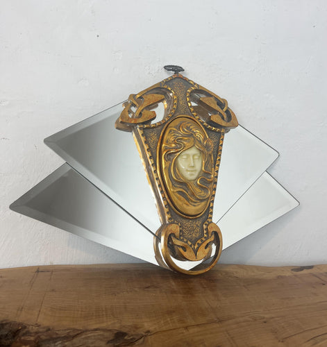 Beautiful vintage art deco mirror featuring glamorous lady and elegant shoal with her stand out features around a vivid golden intricate frame around geometric mirrors,  creating a fabulous design for your home.