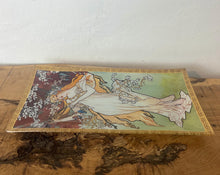 Load image into Gallery viewer, ncredible, vibrant Mucha spring art nouveau ring dish or decorative dish featuring a glamorous lady with a vivid, colourful tree and cherry blossom background. She is wearing a beautiful white dress and a floral headband, playing her harp
