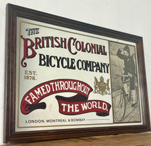 Load image into Gallery viewer, Amazing vintage British Colonial Bicycle Company advertising mirror showing fabulous font in vivid colour on the side in a stunning picture or a policeman with him moustache on an antique bike with the background a far off backdrop
