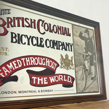 Load image into Gallery viewer, Amazing vintage British Colonial Bicycle Company advertising mirror showing fabulous font in vivid colour on the side in a stunning picture or a policeman with him moustache on an antique bike with the background a far off backdrop
