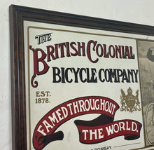 Load image into Gallery viewer, Amazing vintage British Colonial Bicycle Company advertising mirror showing fabulous font in vivid colour on the side in a stunning picture or a policeman with him moustache on an antique bike with the background a far off backdrop
