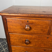 Load image into Gallery viewer, Good quality large antique Victorian mahogany chest of drawers with curved corners, turned bun handles, and a part missing underneath one handle. The bottom drawer is deep and has the plinth attached.
