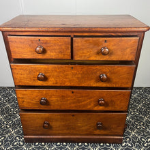 Load image into Gallery viewer, Good quality large antique Victorian mahogany chest of drawers with curved corners, turned bun handles, and a part missing underneath one handle. The bottom drawer is deep and has the plinth attached.
