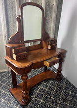 Load image into Gallery viewer, Crafted from elegant quality mahogany, it has a shaped mirror set within a frame. Stunning carved and scrolled supports lead to a pair of two small drawers. It has a moulded edge to the shaped dressing table top with one central drawer.
