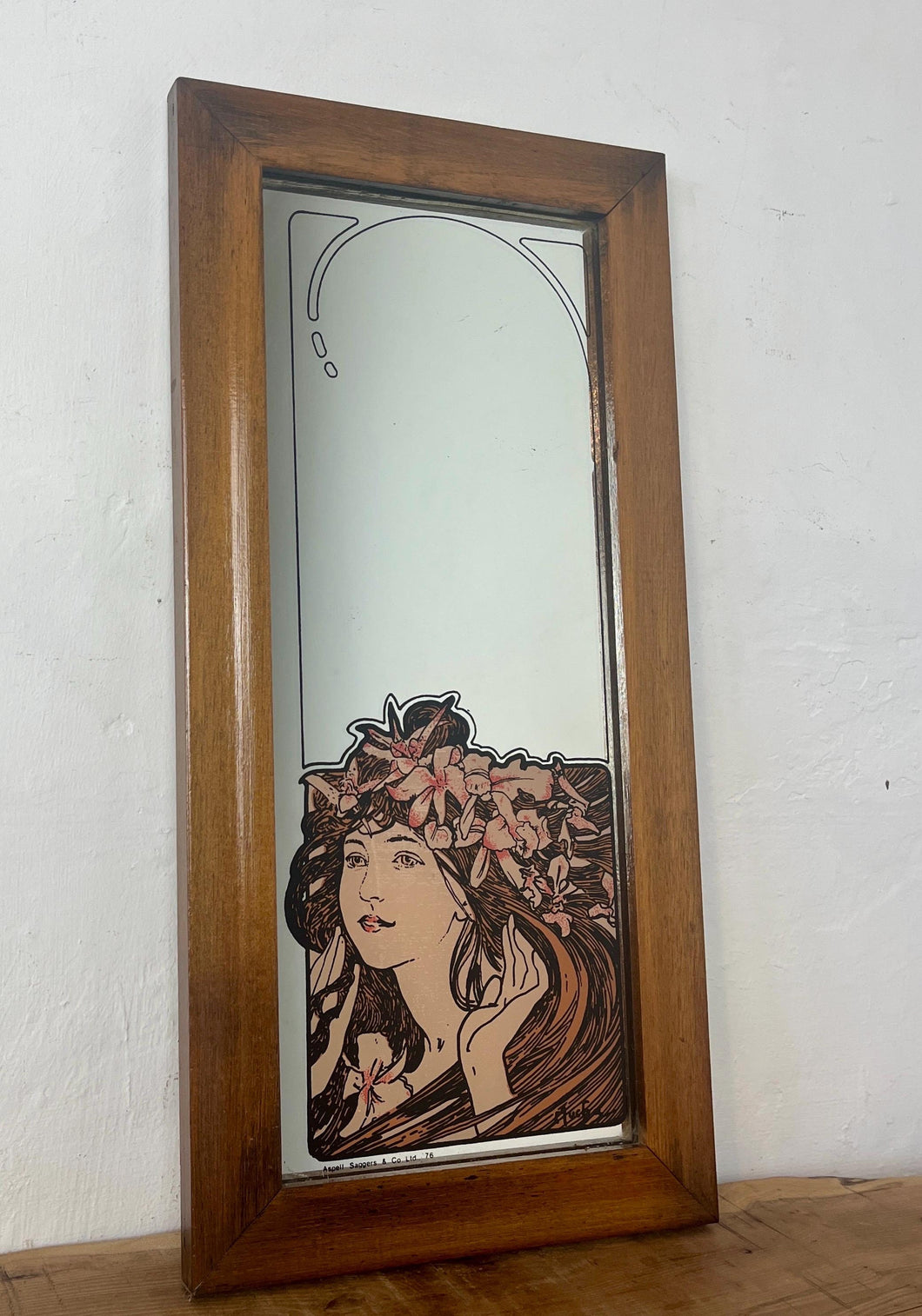 The stunning design features a glamorous lady bust wearing a flower headdress with wonderful detail. The image is focused on the face and hair, with fine design in a subtle peach tone. The border is equally impressive, with a Art Nouveau swirl.