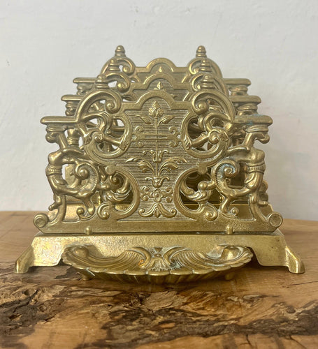 The beautiful ornate letter rack has an intricately detailed finish and vivid tone, three letter opening compartments, and a stunning shell pin dish.