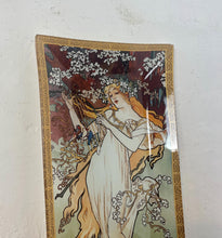 Load image into Gallery viewer, ncredible, vibrant Mucha spring art nouveau ring dish or decorative dish featuring a glamorous lady with a vivid, colourful tree and cherry blossom background. She is wearing a beautiful white dress and a floral headband, playing her harp
