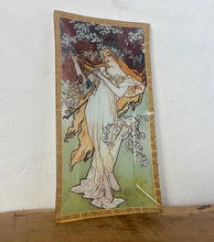 Load image into Gallery viewer, Incredible, vibrant Mucha spring art nouveau ring dish or decorative dish featuring a glamorous lady with a vivid, colourful tree and cherry blossom background. She is wearing a beautiful white dress and a floral headband, playing her harp
