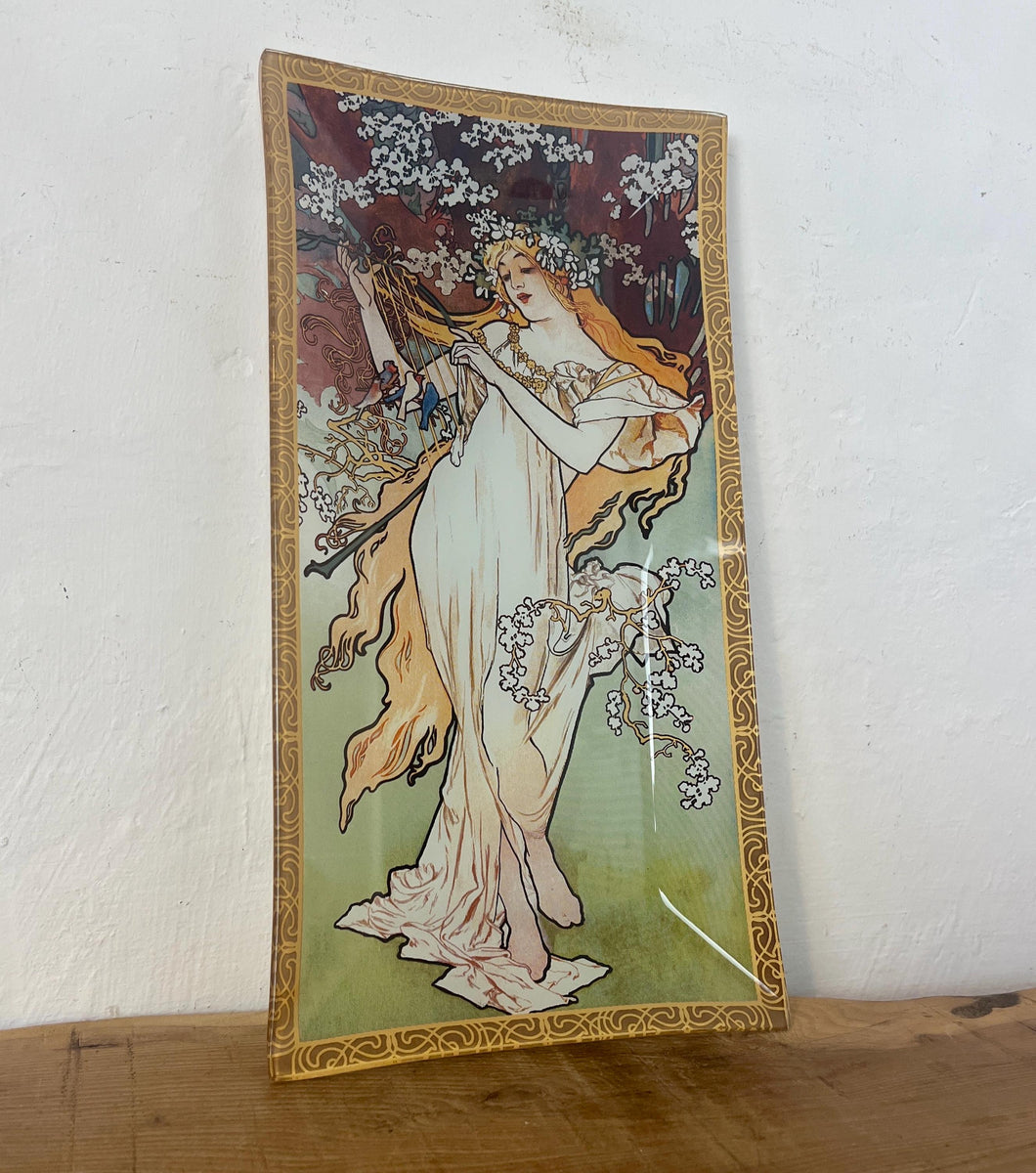 Incredible, vibrant Mucha spring art nouveau ring dish or decorative dish featuring a glamorous lady with a vivid, colourful tree and cherry blossom background. She is wearing a beautiful white dress and a floral headband, playing her harp