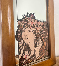 Load image into Gallery viewer, The stunning design features a glamorous lady bust wearing a flower headdress with wonderful detail. The image is focused on the face and hair, with fine design in a subtle peach tone. The border is equally impressive, with a Art Nouveau swirl.
