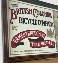 Load image into Gallery viewer, Amazing vintage British Colonial Bicycle Company advertising mirror showing fabulous font in vivid colour on the side in a stunning picture or a policeman with him moustache on an antique bike with the background a far off backdrop
