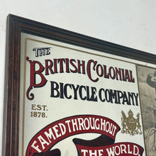 Load image into Gallery viewer, Amazing vintage British Colonial Bicycle Company advertising mirror showing fabulous font in vivid colour on the side in a stunning picture or a policeman with him moustache on an antique bike with the background a far off backdrop
