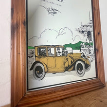 Load image into Gallery viewer, Wonderful vintage automobile mirror featuring an prestige car in mustard tones with the driver and the well dressed couple in the back, bird watching and mountainous background with a selection on people and intricate building.
