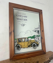 Load image into Gallery viewer, Wonderful vintage automobile mirror featuring an prestige car in mustard tones with the driver and the well dressed couple in the back, bird watching and mountainous background with a selection on people and intricate building.
