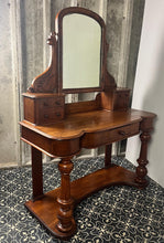 Load image into Gallery viewer, Crafted from elegant quality mahogany, it has a shaped mirror set within a frame. Stunning carved and scrolled supports lead to a pair of two small drawers. It has a moulded edge to the shaped dressing table top with one central drawer.
