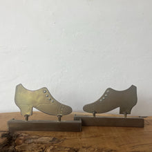 Load image into Gallery viewer, Superb WW1 Trench Art Crafted Lady Shoes Bookends. These were bought as part of a military collection and have been handcrafted from hammered brass, which was produced from a shell casing.
