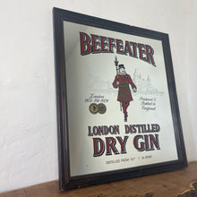 Load image into Gallery viewer, The stunning design features the famous London gin brand in vivid red fonts, a vibrant gold background, and a picture of the familiar logo on the King Body Guard of the Yeomen of the Guard (Beefeater).
