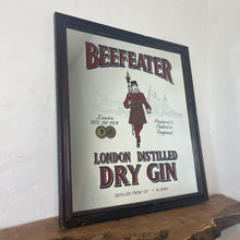 Load image into Gallery viewer, The stunning design features the famous London gin brand in vivid red fonts, a vibrant gold background, and a picture of the familiar logo on the King Body Guard of the Yeomen of the Guard (Beefeater).
