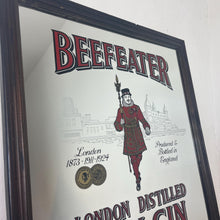Load image into Gallery viewer, The stunning design features the famous London gin brand in vivid red fonts, a vibrant gold background, and a picture of the familiar logo on the King Body Guard of the Yeomen of the Guard (Beefeater).
