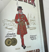 Load image into Gallery viewer, The stunning design features the famous London gin brand in vivid red fonts, a vibrant gold background, and a picture of the familiar logo on the King Body Guard of the Yeomen of the Guard (Beefeater).
