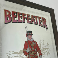 Load image into Gallery viewer, The stunning design features the famous London gin brand in vivid red fonts, a vibrant gold background, and a picture of the familiar logo on the King Body Guard of the Yeomen of the Guard (Beefeater).
