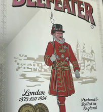 Load image into Gallery viewer, The stunning design features the famous London gin brand in vivid red fonts, a vibrant gold background, and a picture of the familiar logo on the King Body Guard of the Yeomen of the Guard (Beefeater).
