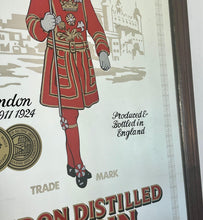 Load image into Gallery viewer, The stunning design features the famous London gin brand in vivid red fonts, a vibrant gold background, and a picture of the familiar logo on the King Body Guard of the Yeomen of the Guard (Beefeater).

