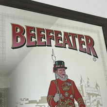 Load image into Gallery viewer, The stunning design features the famous London gin brand in vivid red fonts, a vibrant gold background, and a picture of the familiar logo on the King Body Guard of the Yeomen of the Guard (Beefeater).
