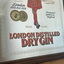 Load image into Gallery viewer, The stunning design features the famous London gin brand in vivid red fonts, a vibrant gold background, and a picture of the familiar logo on the King Body Guard of the Yeomen of the Guard (Beefeater).
