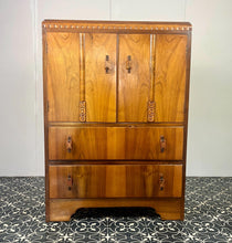 Load image into Gallery viewer, This cabinet contains a long cupboard with vivid-tone burr walnut doors on either side and a stunning detailed design. It has two shelves underneath for extra storage, making it the perfect place to store your martini accessories.
