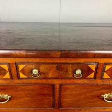 Load image into Gallery viewer, This is a classic late Georgian, mahogany, English chest of drawers dating to early c.1800.This large chest has seven drawers: three small drawers, two medium drawers, and two full-length drawers. It offers generous storage in an elegant and practical form.
