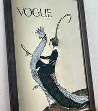 Load image into Gallery viewer, This exquisite vintage item showcases a captivating peacock design that draws inspiration from Vogue&#39;s April 1918 magazine cover. It depicts a sophisticated lady adorned with a fashionable headband, holding a mirror above the Vogue designer logo, all encased within a delicate border.

