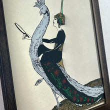 Load image into Gallery viewer, This exquisite vintage item showcases a captivating peacock design that draws inspiration from Vogue&#39;s April 1918 magazine cover. It depicts a sophisticated lady adorned with a fashionable headband, holding a mirror above the Vogue designer logo, all encased within a delicate border.
