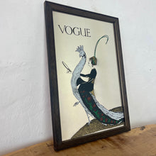 Load image into Gallery viewer, This exquisite vintage item showcases a captivating peacock design that draws inspiration from Vogue&#39;s April 1918 magazine cover. It depicts a sophisticated lady adorned with a fashionable headband, holding a mirror above the Vogue designer logo, all encased within a delicate border.
