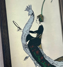 Load image into Gallery viewer, This exquisite vintage item showcases a captivating peacock design that draws inspiration from Vogue&#39;s April 1918 magazine cover. It depicts a sophisticated lady adorned with a fashionable headband, holding a mirror above the Vogue designer logo, all encased within a delicate border.
