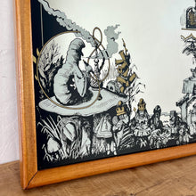 Load image into Gallery viewer, The stunning vintage mirror features intricate designer pictures, including a scene from Alice in Wonderland, showing a selection of characters from the fairytale, with exquisite detail, noir effect, and hints of gold.
