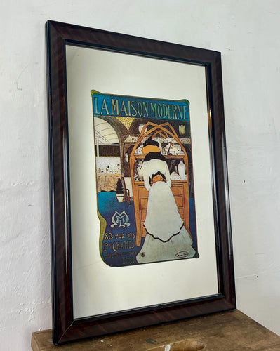 It was designed by Maurice Biais, a notable artist and designer of the Belle Époque style. The poster showcases a woman admiring the Art Nouveau items available at the gallery.