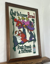 Load image into Gallery viewer, Beautiful French advertising piece of a well-known brand, a vivid, colourful design depicting a group of people in 60s fashionable clothing with a psychedelic feel picturing a couple, people dancing, and moulin rouge dancers on the exterior on the picture is the trendy fonts depicting the branding and further detail “ fresh, french and different” plus a picture of a bottle of Pernod on the edging in a waved colourful border in a wooden frame.
